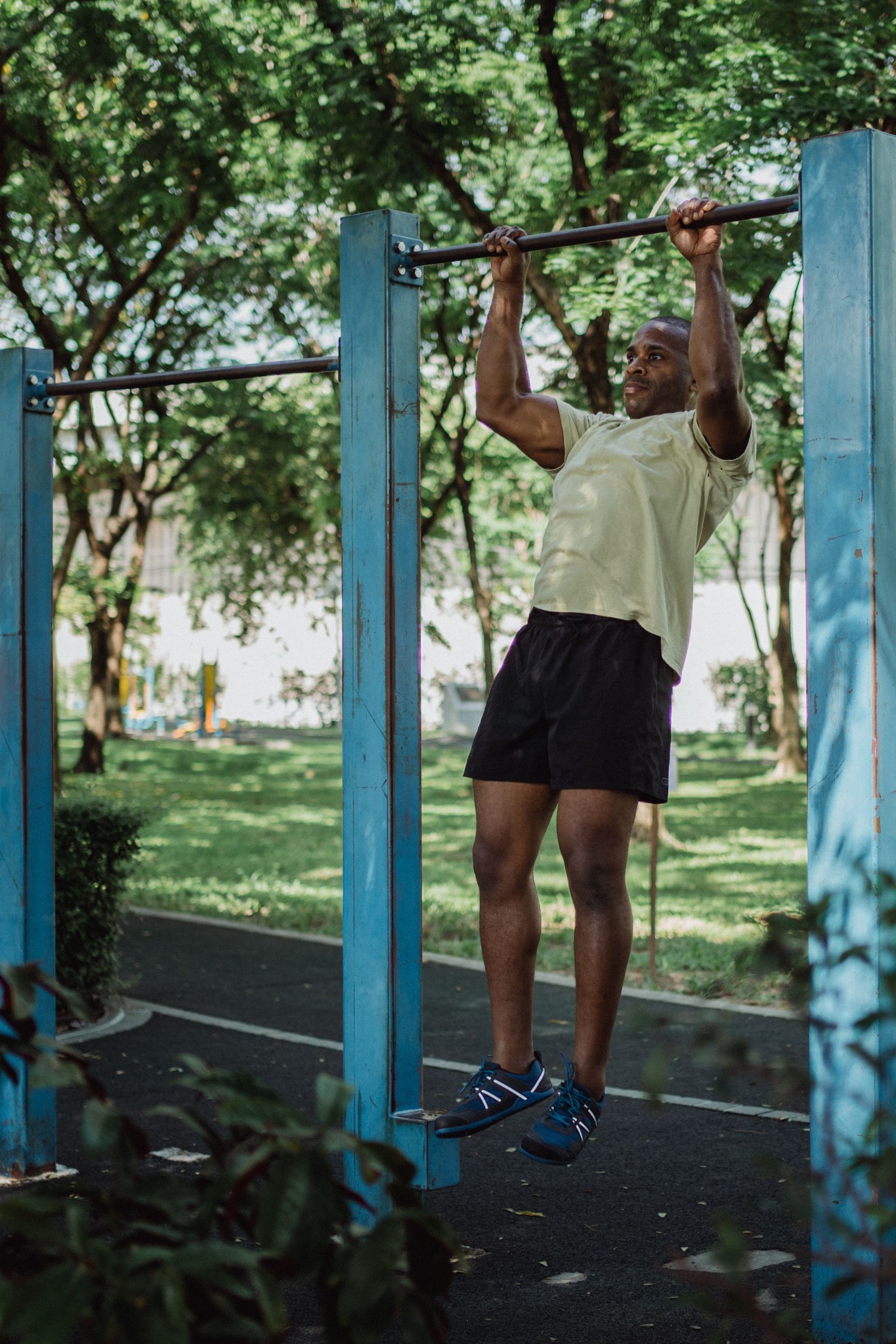 Athlete performing a pull-up outdoors