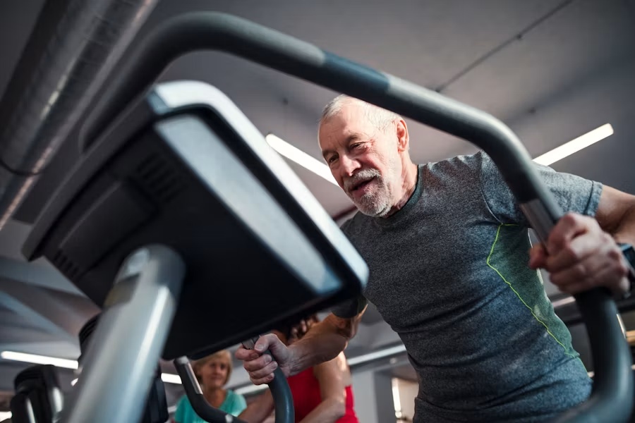 Older adult building cardiovascular fitness with guided exercise
