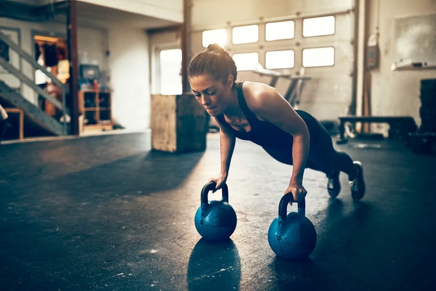 Athlete building functional strength with kettlebells