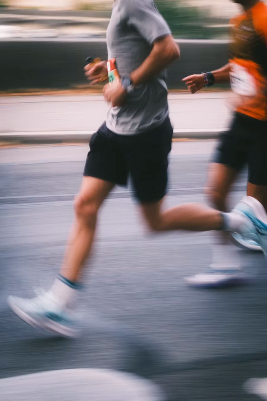 Runners training for endurance on the road